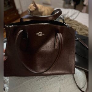 ***SOLD****EUC deep plum Coach hand bag with cross body strap.